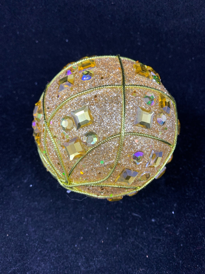 GOLD GLITTER PLASTIC ORNAMENT.