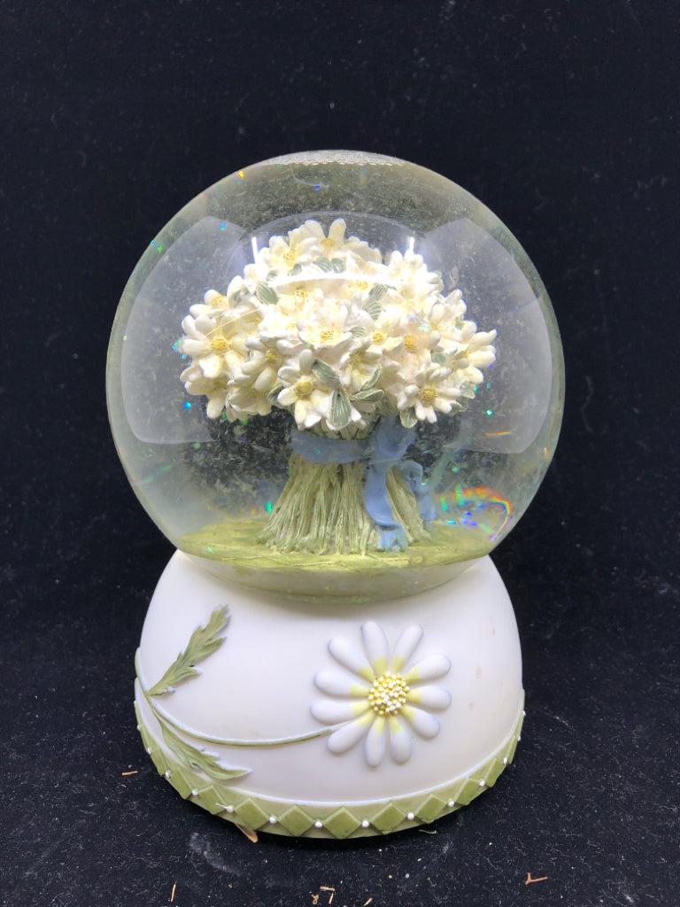 MUSICAL SNOW GLOBE WITH WHITE BOUQUET OF FLOWERS.
