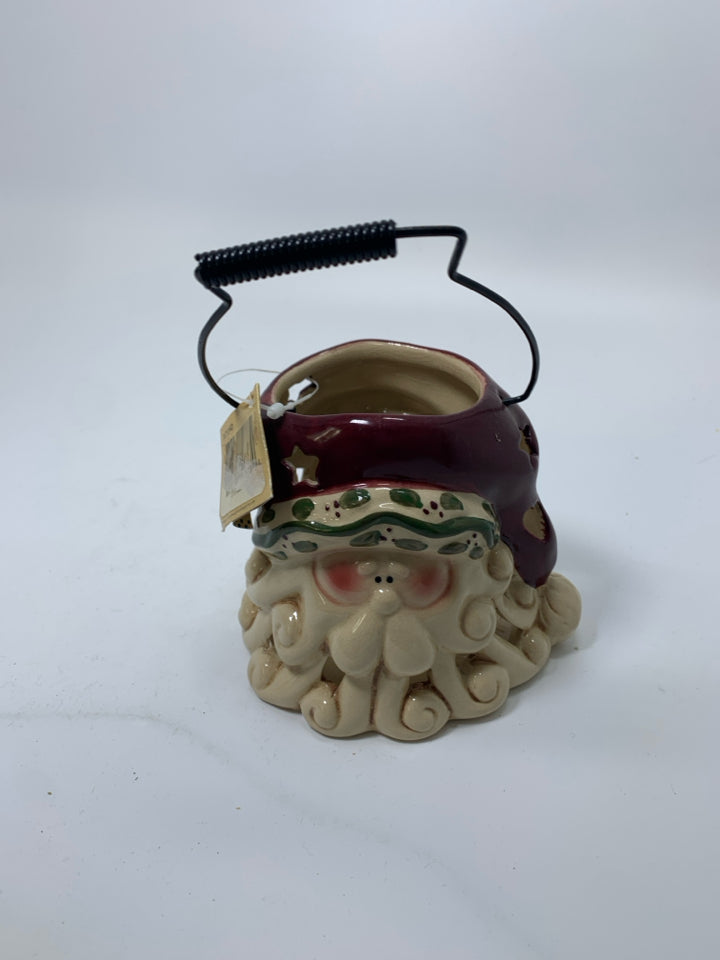 PRIMITIVE STYLE PIERCED SANTA HEAD LANTERN.