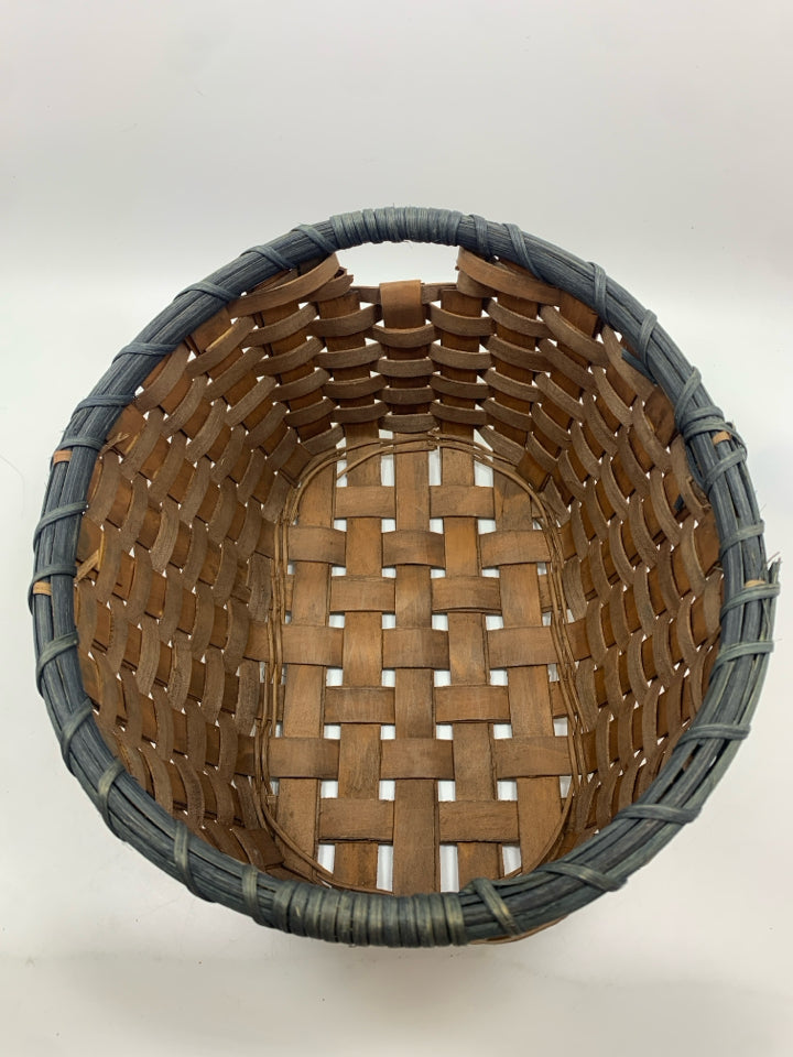 OVAL WOVEN BASKET W/BLUE RIM.