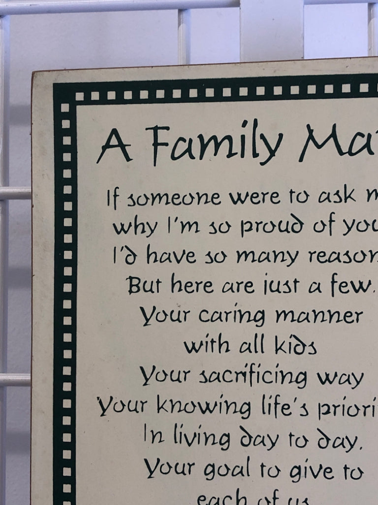 A FAMILY MAN GREEN AND YELLOW WALL ART.