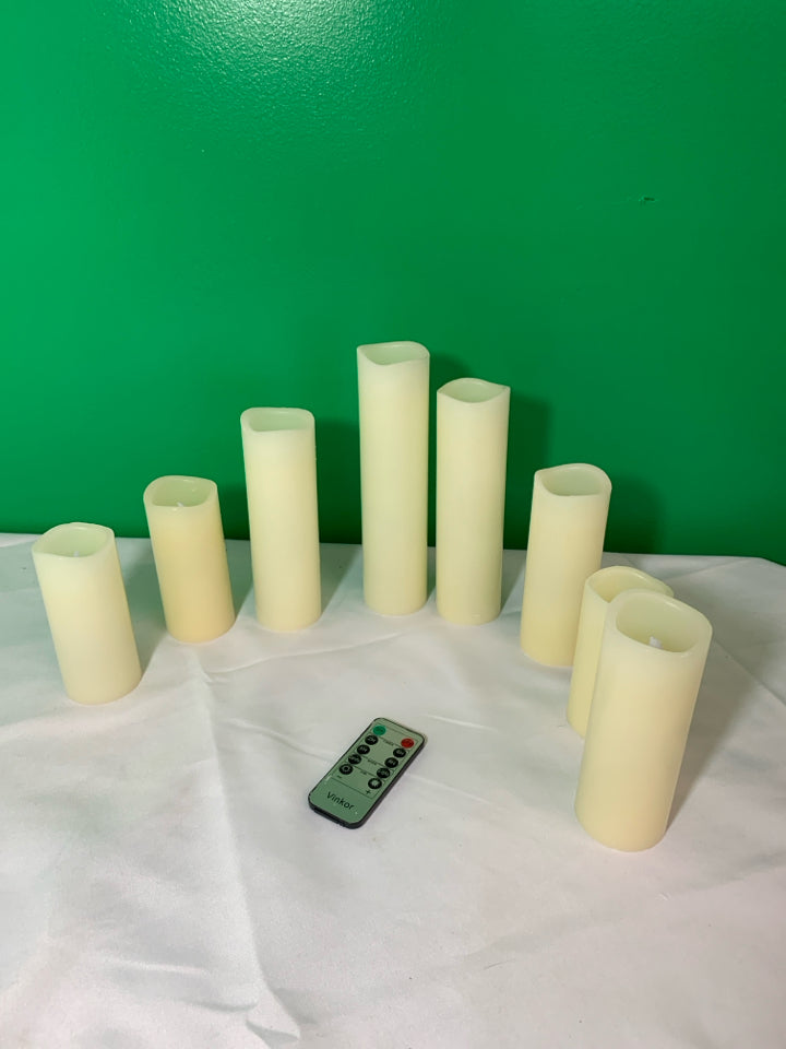 8 WHITE BATTERY OPERATED CANDLES WITH REMOTE.