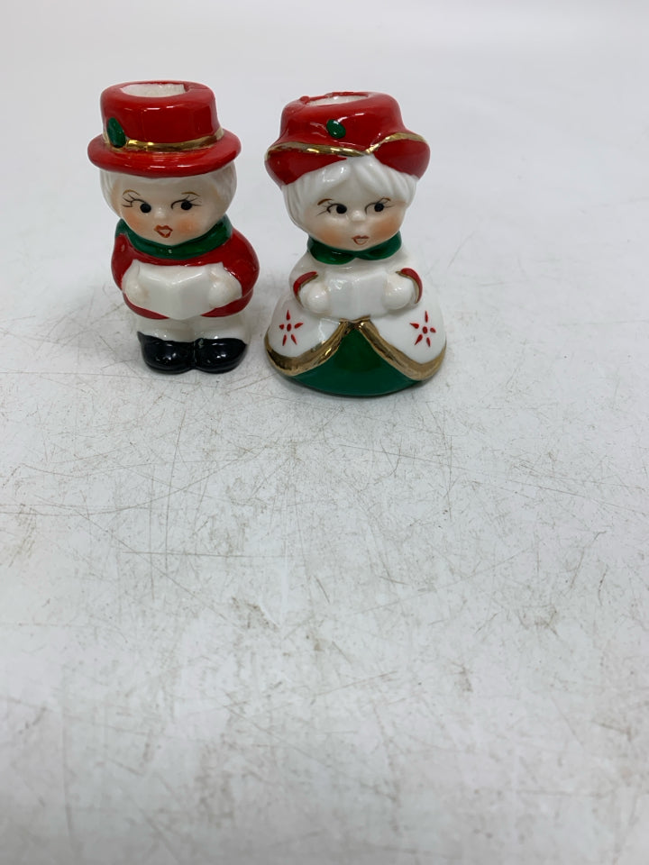2 SMALL PORCELAIN MAN/WOMAN CAROLERS TAPERED CANDLE HOLDERS IN BAG.