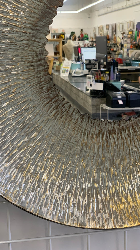 LARGE ROUND METAL MIRROR.