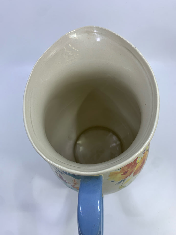 FLORAL PITCHER W/BLUE HANDLE.