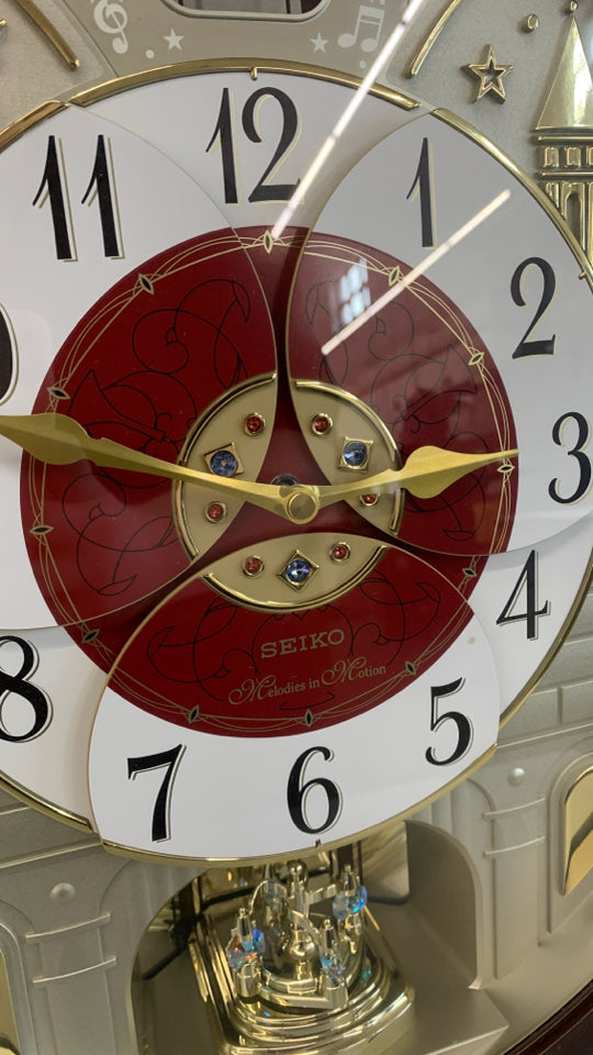 MELODIES IN MOTION SWAROVSKI WALL CLOCK.
