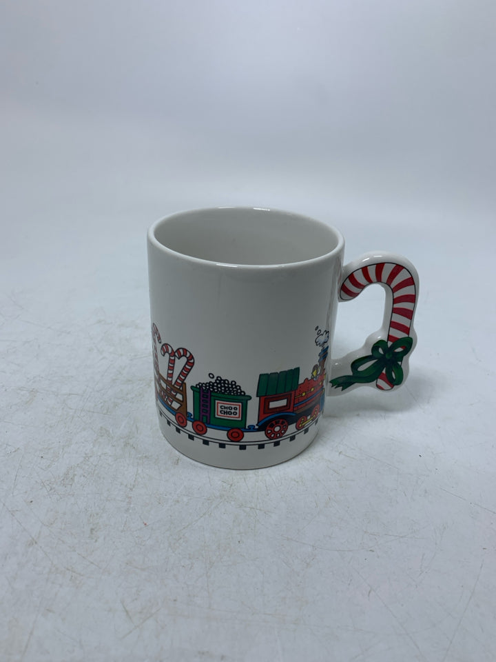 VTG WHITE MUG W/ CANDY CANE HANDLE TRAIN AROUND.
