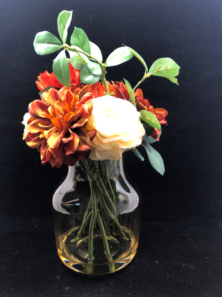 DARK ORANGE/WHITE FAUX ROSES IN YELLOW TINTED GLASS VASE.