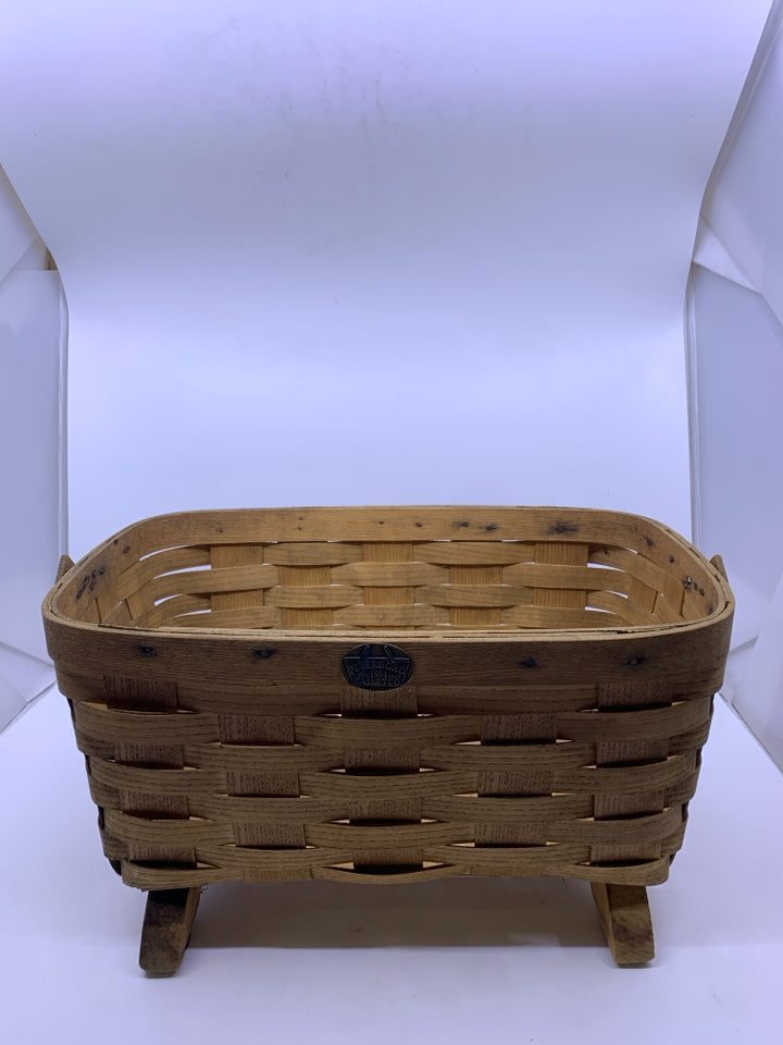 FOOTED PETERBORO BASKET W PLASTIC LINER AND HANDLE.