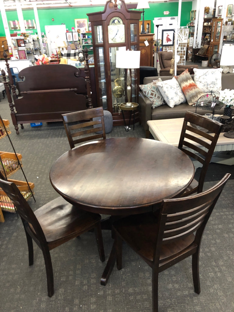 DRK WOOD ROUND TABLE W/4 CHAIRS.