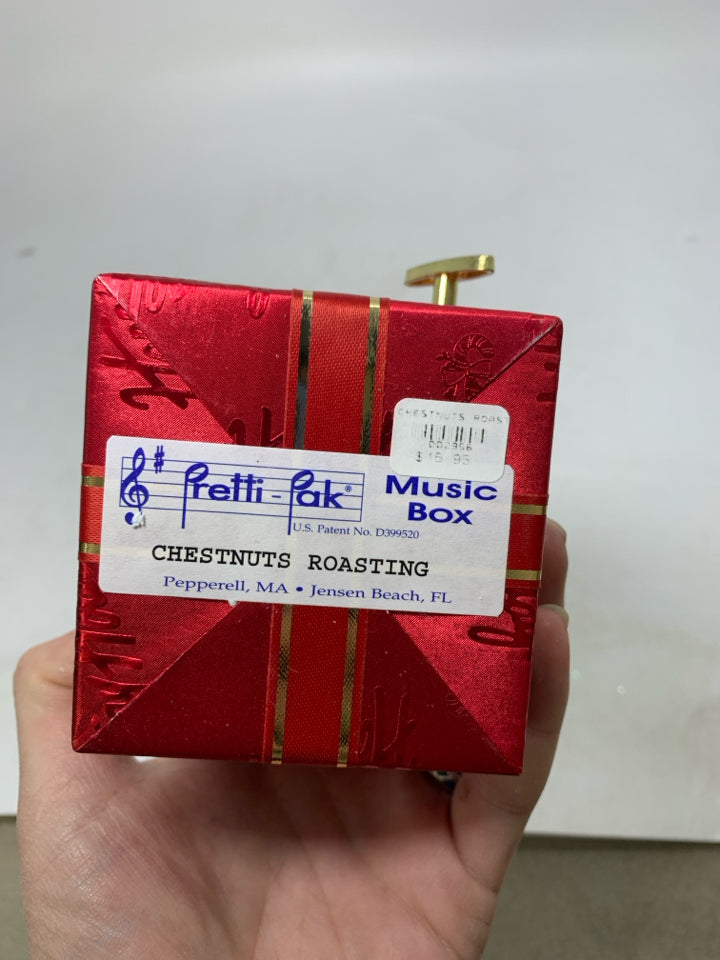 RED WRAPPED PRESENT " CHESTNUTS ROASTING" MUSIC BOX.