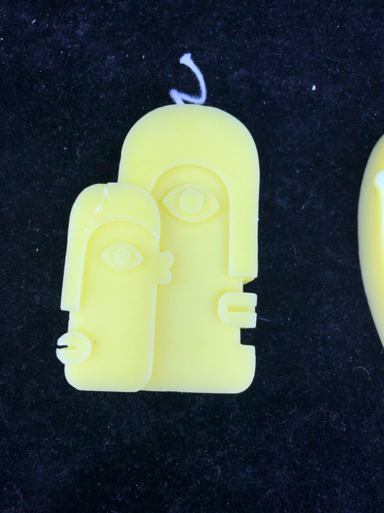 3 ABSTRACT FACE SHAPED CANDLES.