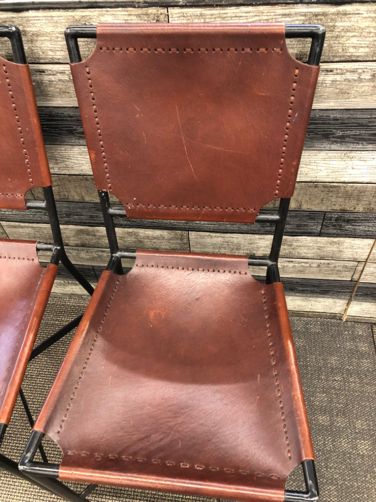 2 BROWN LEATHER CHAIRS CRATE & BARREL.