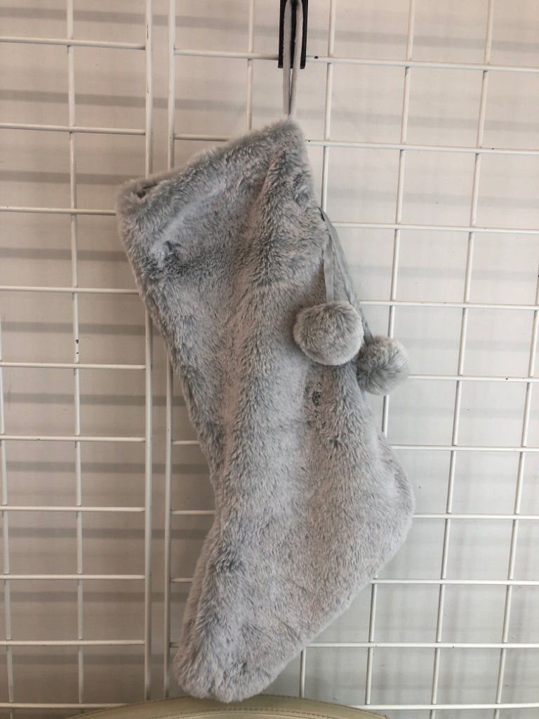 GRAY FLUFFY STOCKING W/ POM POMS.