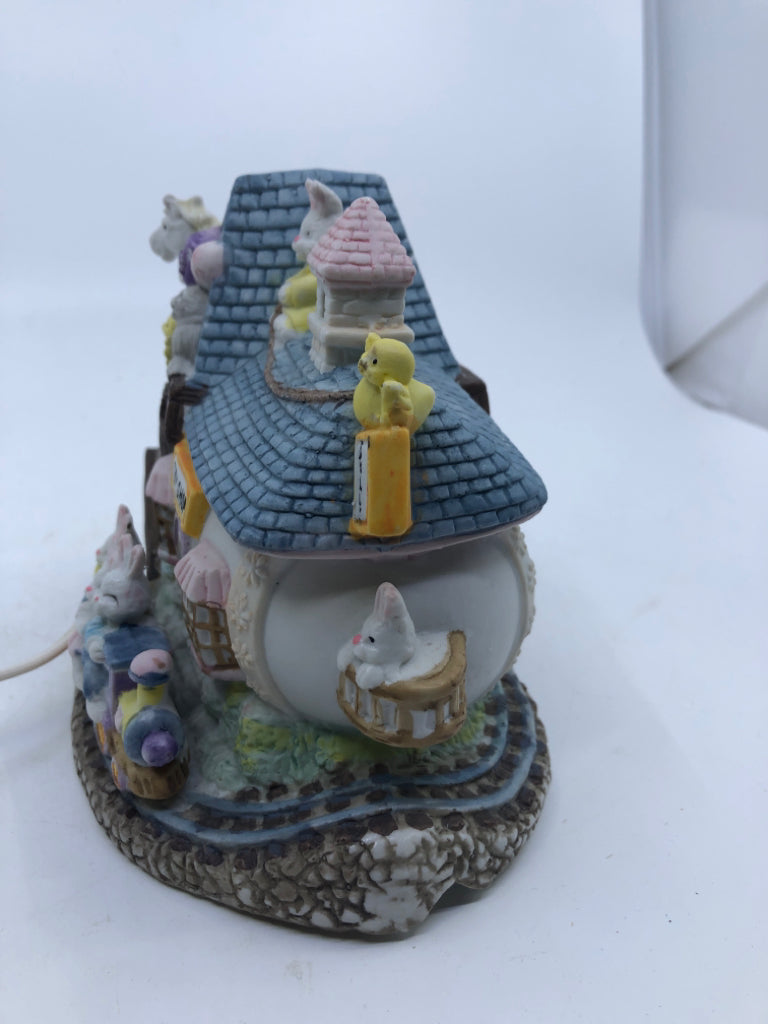 CERAMIC VILLAGE TOY SHOP LIGHT-UP EASTER DECORATION.