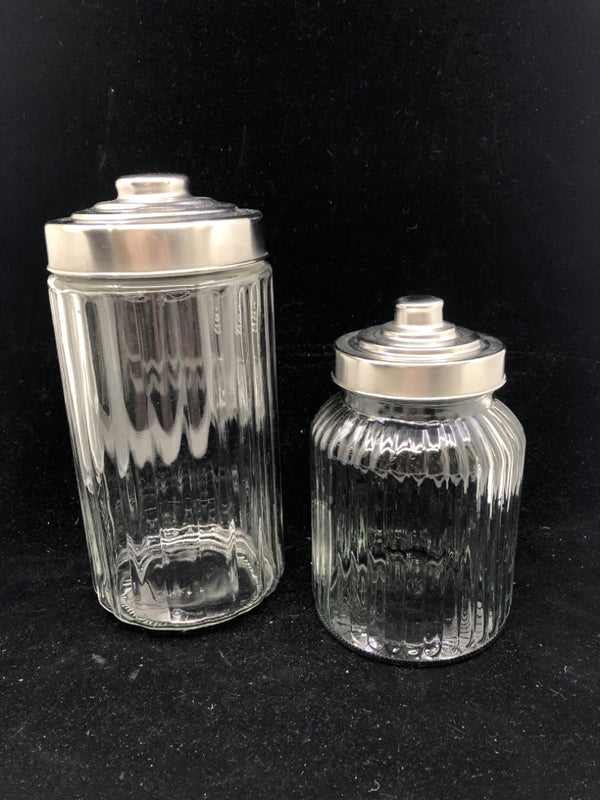 2 RIBBED GLASS CANISTER W SILVER TOP.