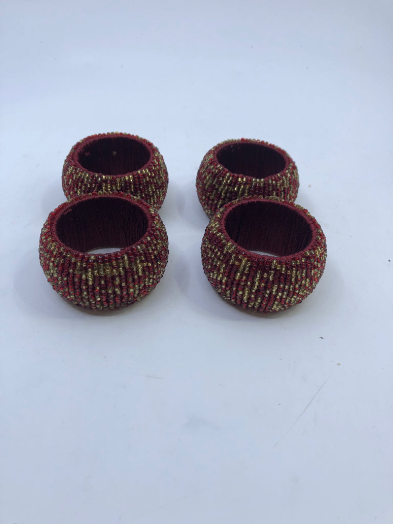 4 RED BEADED NAPKIN RINGS.