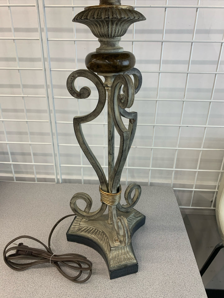 SILVER SCROLL BASE LAMP W/BROWN EMBROIDERED EDGE SHADE.