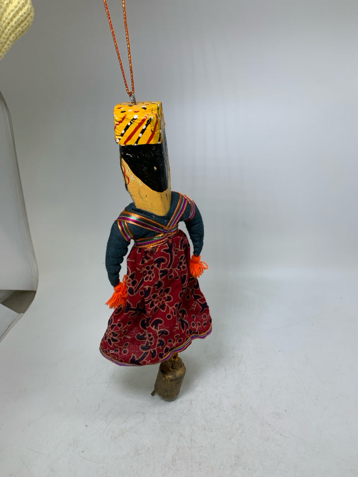 MAN W/ MUSTACHE DRESS ON WALL HANGING W/ BELL.