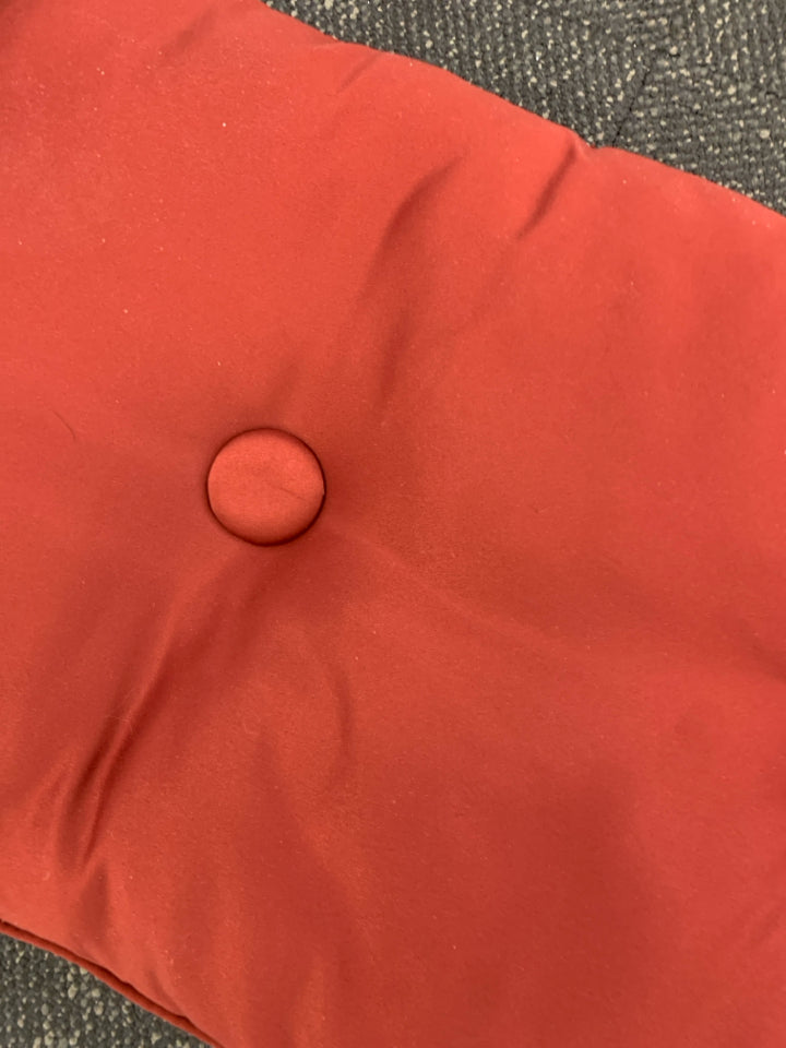 RED TUFTED BENCH CUSHION.