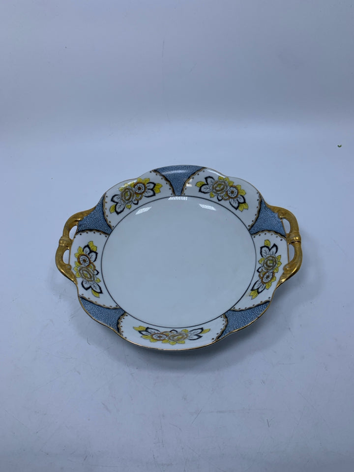 VTG DOUBLE HANDLED SERVING BOWL W/ BLUE & YELLOW FLORAL DETAIL.