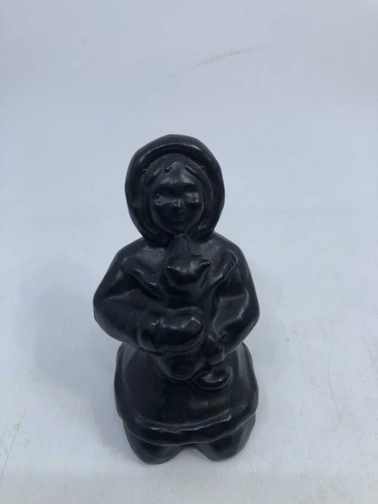 GIRL IN SNOW-COAT HUGGING ANIMAL HAND CARVING COLUMBIA COAST ARTWARE.