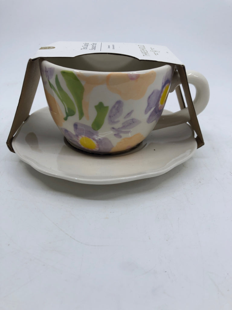 NIP TEACUP/SAUCER SET WHITE W/ PAINTED PURPLE FLOWERS RABBIT IN CENTER.
