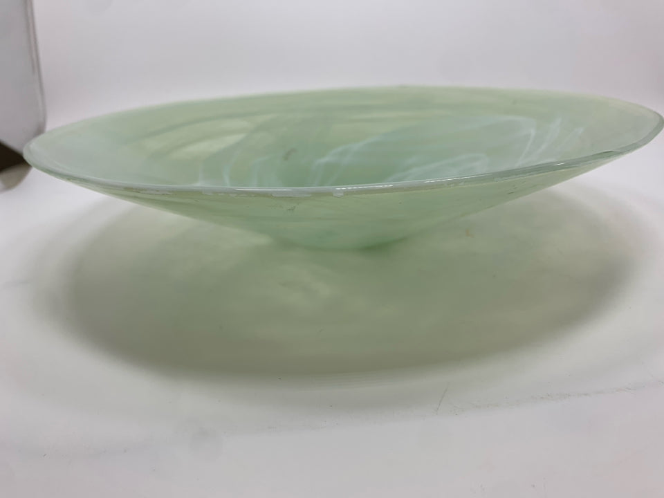 WHITE SWIRL IN GREEN GLASS BOWL.