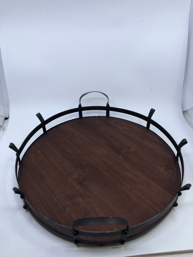 DARK WOOD CIRCLE TRAY W/ METAL EDGE+HANDLES.