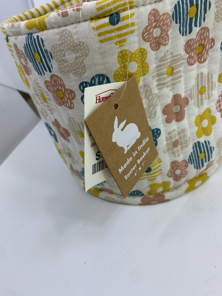 FLORAL FABRIC BIN W/YELLOW STRIPES ON INSIDE.