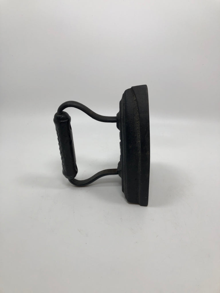VTG SAD IRON METAL DOOR STOPPER.
