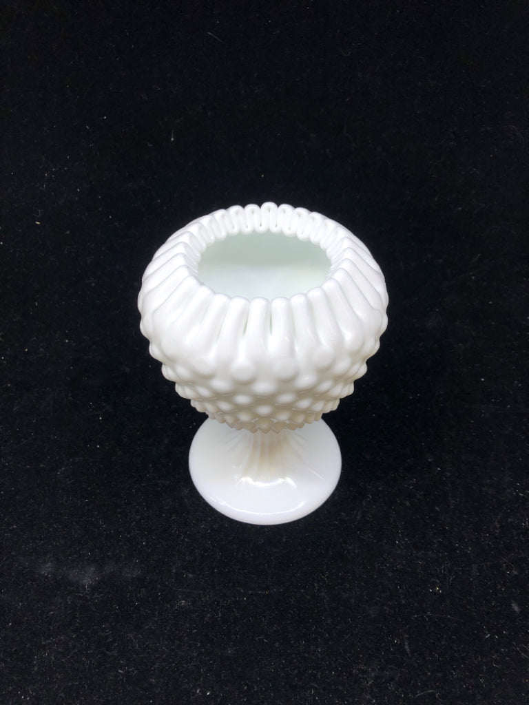FOOTED MILK GLASS VASE W PINCHED RIM.