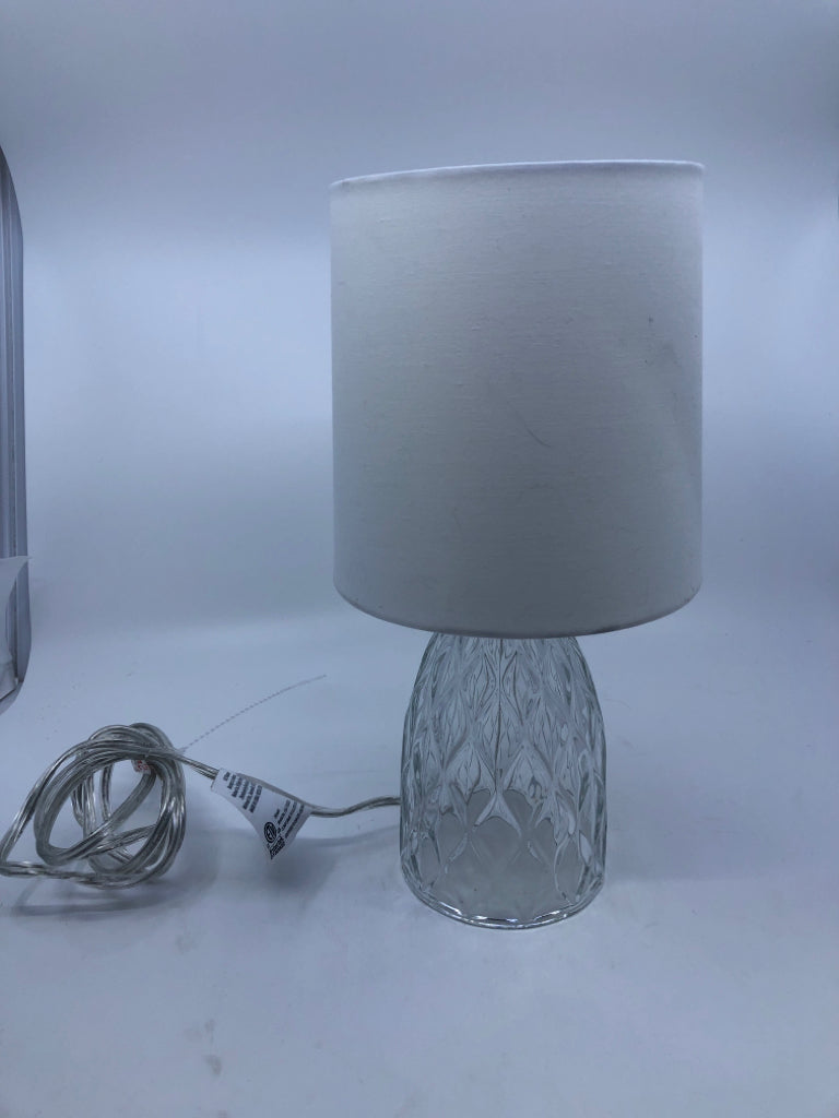 CLEAR GLASS LAMP W WHITE SHADE.