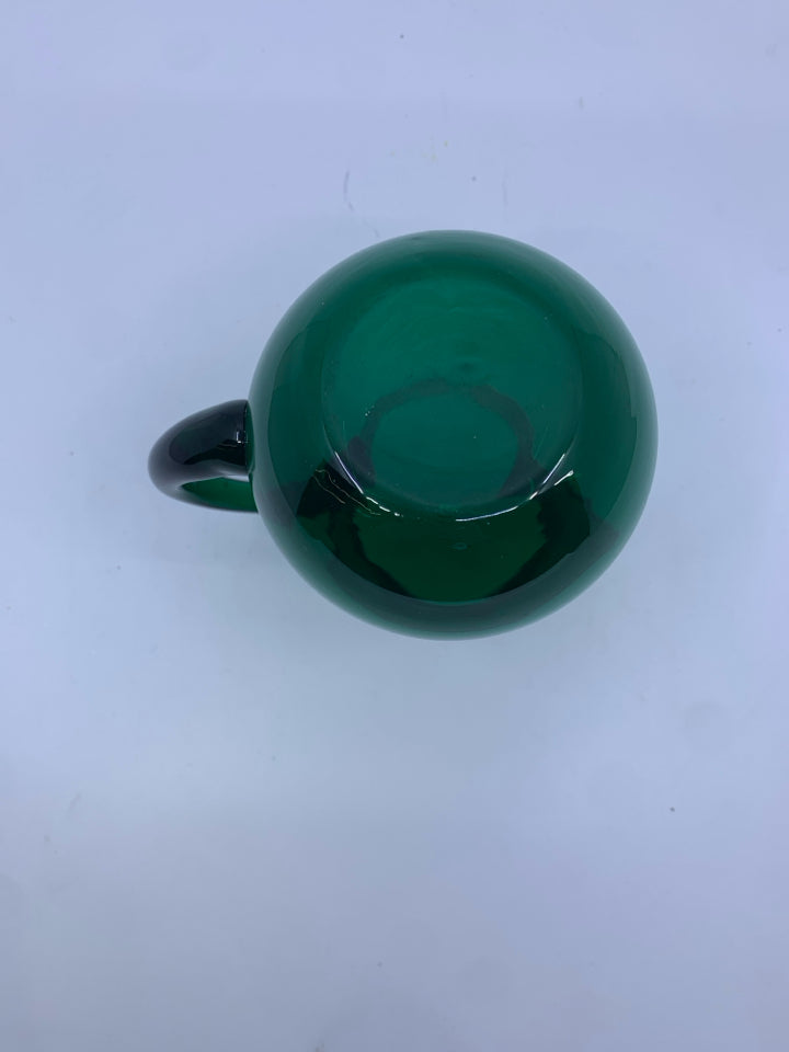 SMALL LIGHT GREEN GLASS PITCHER.