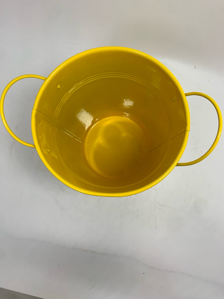 YELLOW METAL BUCKET.