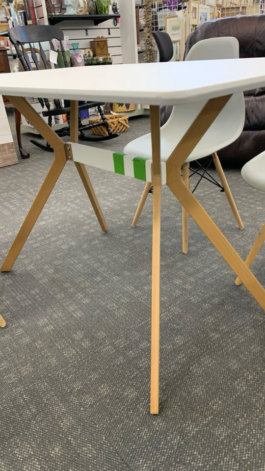 4 CHAIRS + WOOD TABLE W/ANGLED WOOD LEGS.