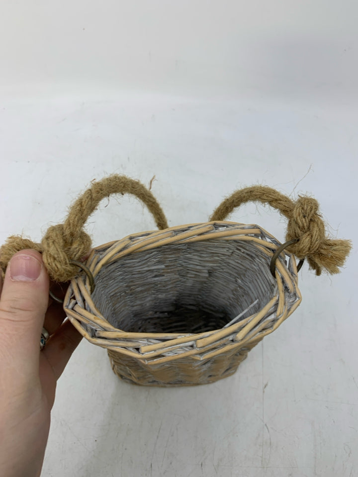 SMALL WHITE WASHED BASKET W/ LONG TWINE HANDLE.