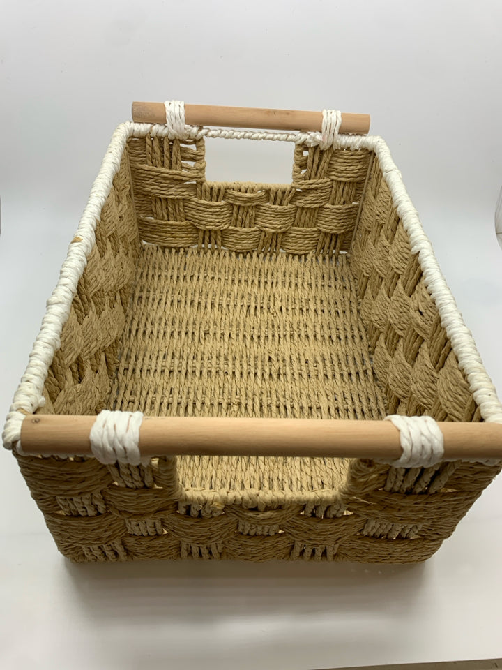 WOVEN BASKET W/DOWEL HANDLES AND WHITE EDGE.