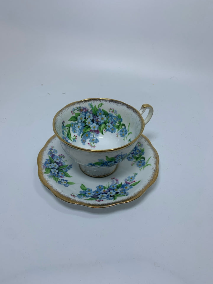 LIGHT BLUE SMALL FLOWERS W/ GOLD RIM.