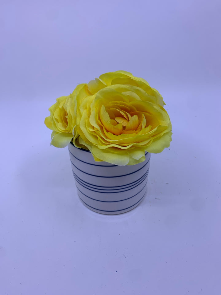 YELLOW FLORAL IN BLUE AND WHITE VASE.