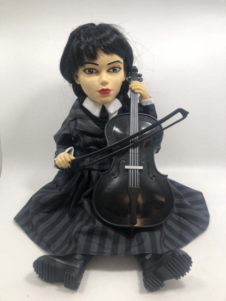 MUSICAL WEDNESDAY ADAMS PLAYING CELLO.