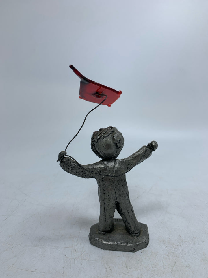BOY FLYING A KITE FIGURINE.