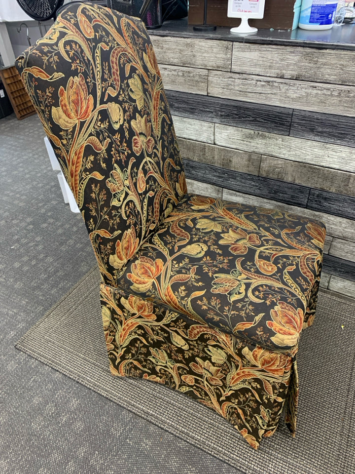 BLACK FLORAL UPHOLSTERED SLIPPER CHAIR.