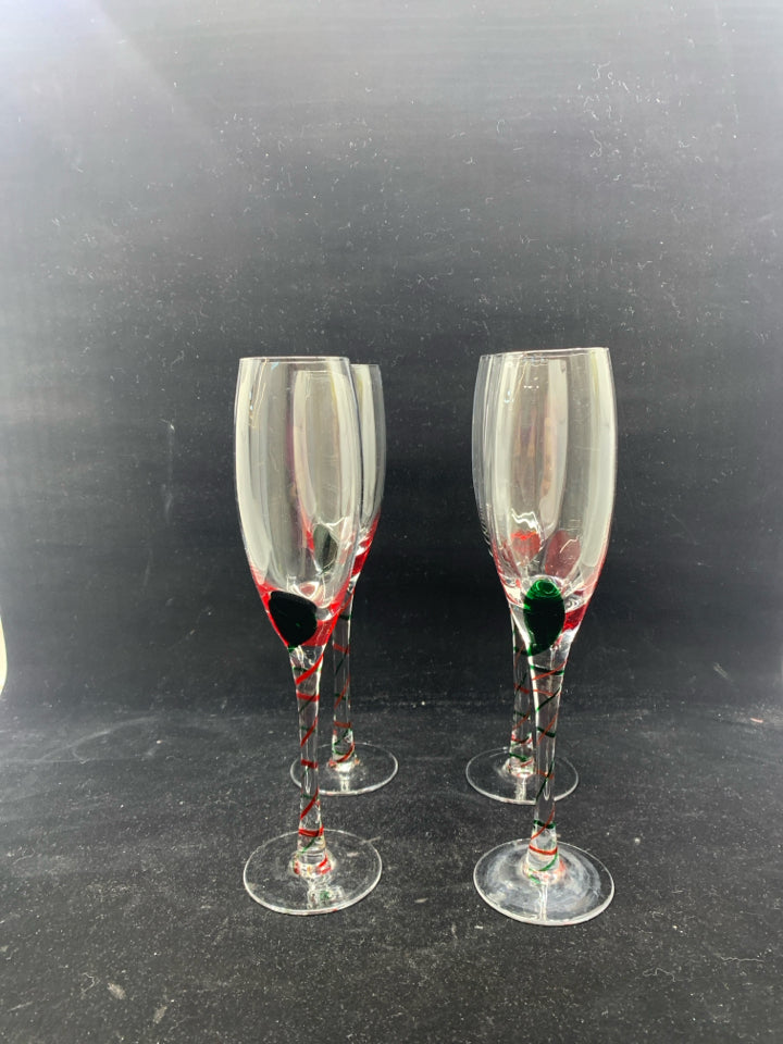 4 GLASS CHAMPAGNE FLUTES W/ RED+GREEN SWIRL DESIGN.