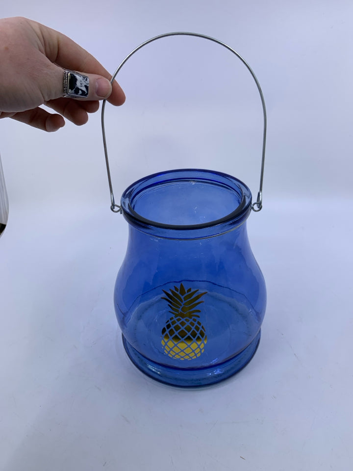 LARGE BLUE GLASS LANTERN W/ PRINTED GOLD PINEAPPLE.