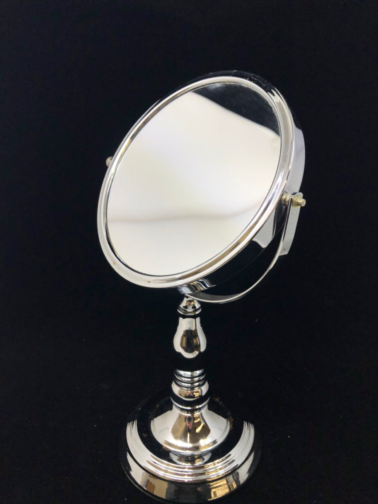 SILVER VANITY MIRROR W/FLIP MAGNIFICATION.
