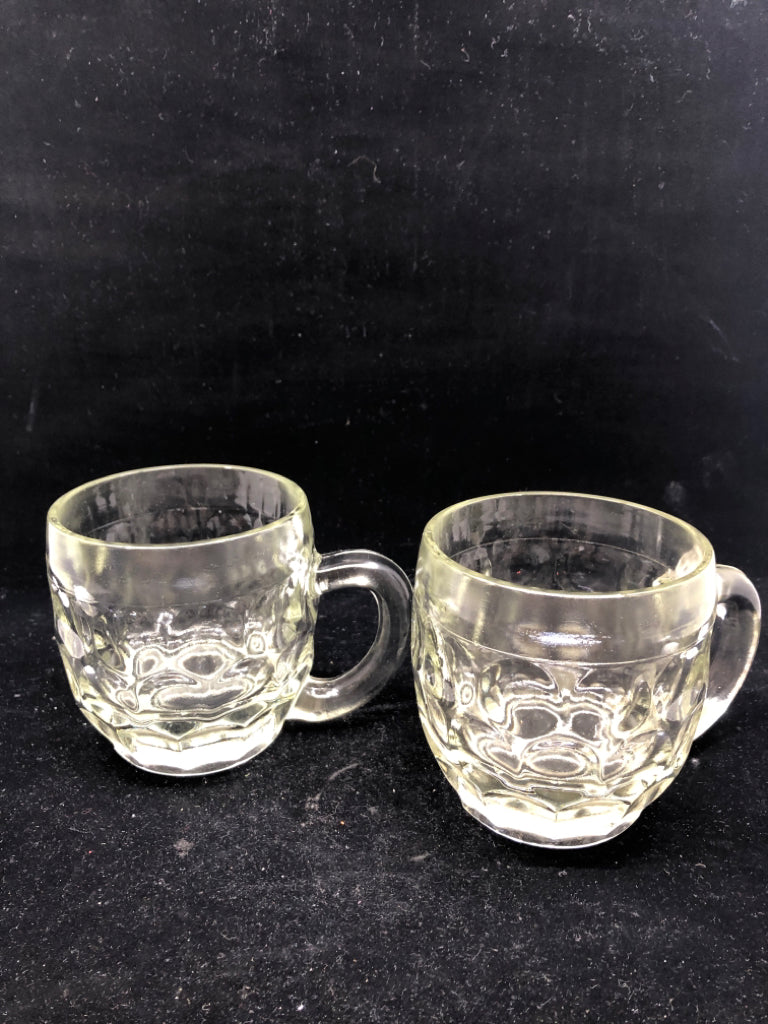 2 HEAVY THUMBPRINT GLASS MUGS.