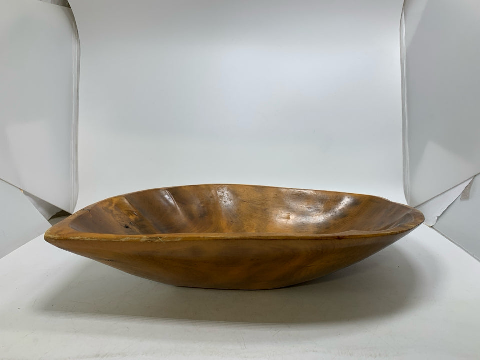 OVAL GLAZED CRAVED WOOD BOWL W/ POINTED EDGE.