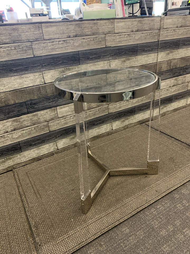 SILVER AND GLASS CIRCLE END TABLE W/ 3 LEGS.