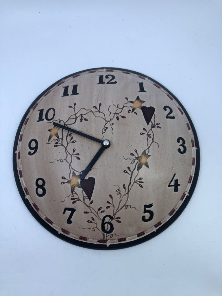 WOOD ROUND PRIMITIVE WALL CLOCK.